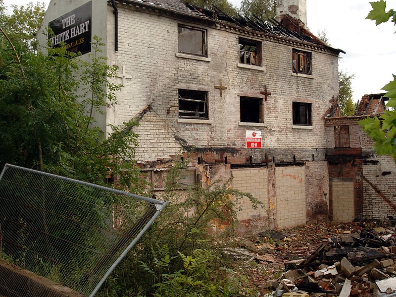 The roof is all  burned through, and there is a warning sign up. It's August 2008 and the White Hart is by now derelict, having been targeted by arsonists.