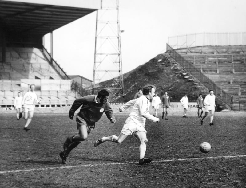 Billy Bremner cuts out a pass intended for Johanneson during a practice game at Leeds United's Elland Road stadium in March 1969