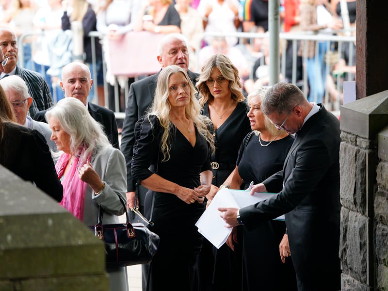 Mourners arriving for the funeral of Bonnie Tyler at Swansea Minster. 