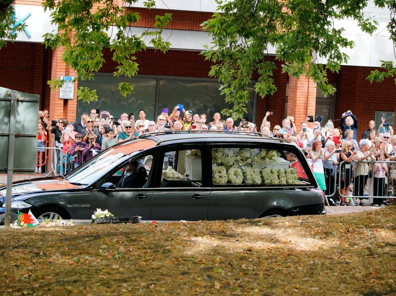 The hearse carrying the coffin as it arrives for the funeral of Bonnie Tyler at Swansea Minster. 