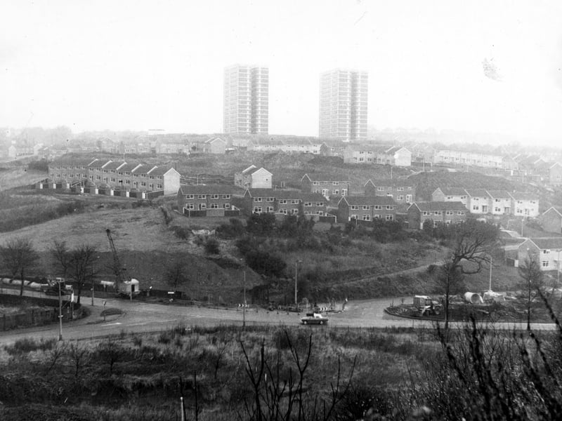Looking north east over the junction of Pudsey Road and Ring Road, Bramley and Farnley. Houses in background are part of Gamble Hill estate. Pictured in December 1968.