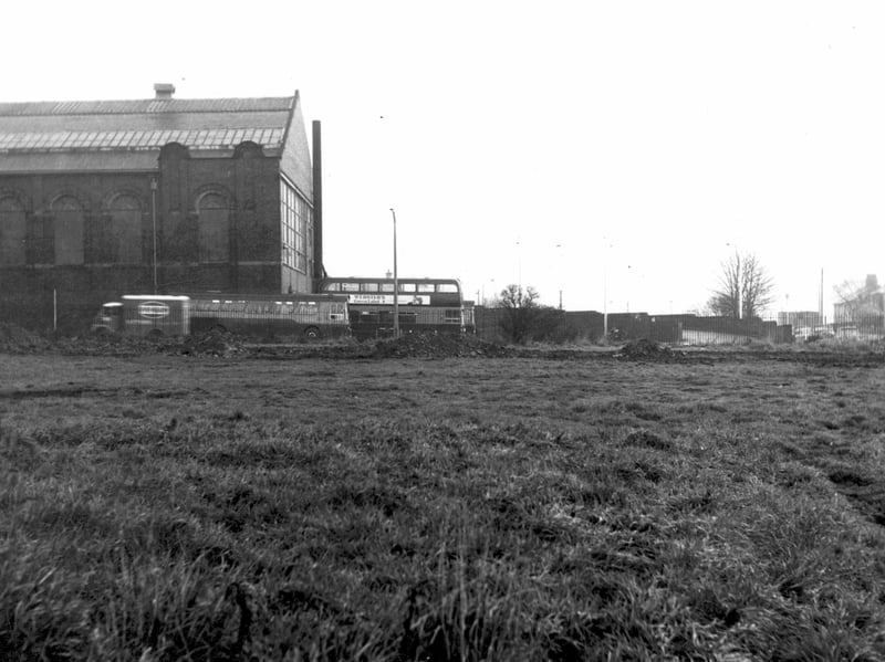 A view looking east across Henconner Lane at Bramley Bus Depot. Two buses and a van are visible. Pictured December 1968.