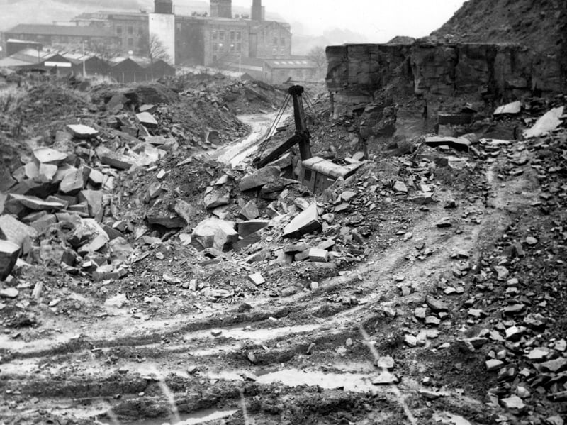 Looking east along Park Spring Quarry, Hough End, towards mill in background. A power shovel can be seen in the centre of the photo from December 1968.