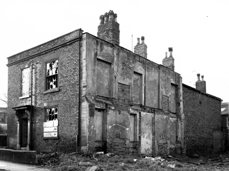 Number 40 Chapel Lane stands derelict to the left of this view. Moving right the remains of number 38, then in the background, the backs of properties on Roger's Place. Included in the Armley slum clearance programme. Pictured in December 1967.