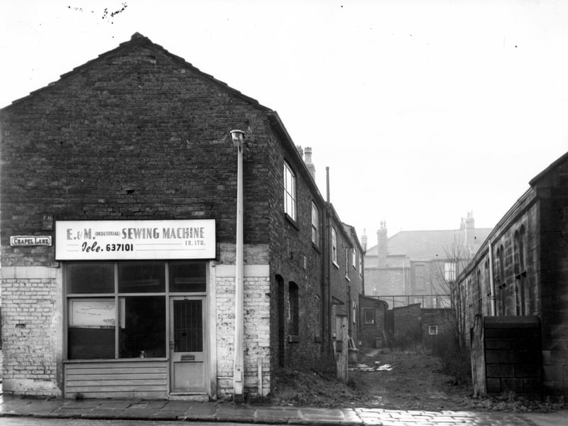 Chapel Lane in December 1967, To the left of this view is number 60 Chapel Lane, premises of E and M (Industrial) Sewing Machine Co Ltd, sewing machine engineers and agents. Moving right, the backs of houses on Church Road. Back Wesley Road in the distance then part of Armley Higher Grade School on the right edge.