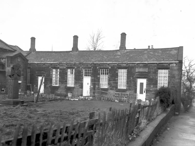 These three houses on Chapel Lane were also known as Gott's Almshouses. The entrance to the former Armley Higher Grade School is on the left edge of this view behind the celtic cross. Moving right, number 50 Chapel Lane is on the left, 48 in the centre and 46 on the right. Pictured in December 1967.