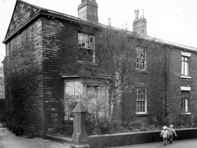 Number 44 Chapel Lane stands derelict in the centre of this view. The entrance to this property was round the back. It was included in the Armley slum clearance area although number 42, just seen on the right edge was not.