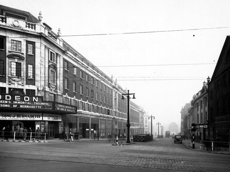 The Headrow, looking east from the junction with Briggate towards Eastgate in November 1944. The Odeon cinema was showing The Song Of Bernadette.