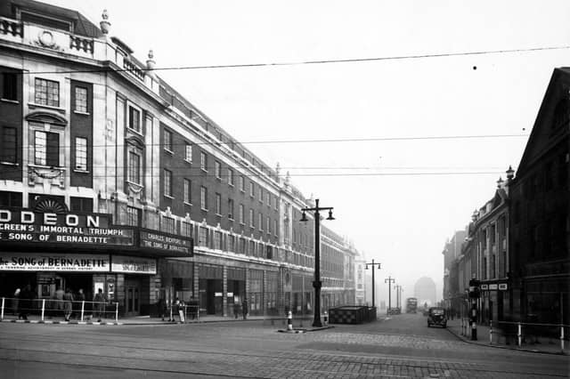 The Headrow, looking east from the junction with Briggate towards Eastgate in November 1944. The Odeon cinema was showing The Song Of Bernadette.