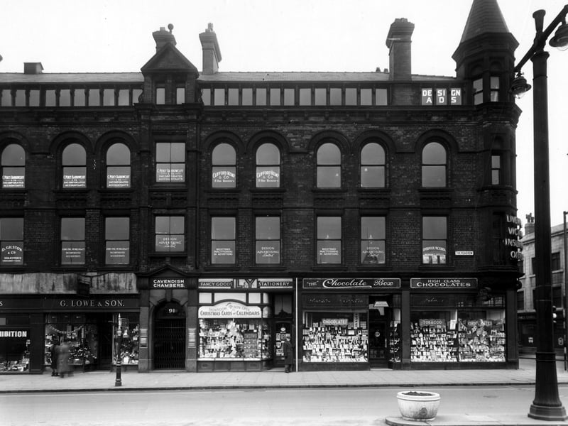 The south west side of The Headrow in December 1949 showing number 89 G. Lowe and Son leather goods, 91 Cavendish chambers containing offices of solicitors, accountants and advertising agencies, 93 Lancashire and Yorkshire stationery Co. Ltd., 95 G.W. Wilson confectioner. The Liverpool Victoria Insurance Co. is just visible on the corner with Albion Street.