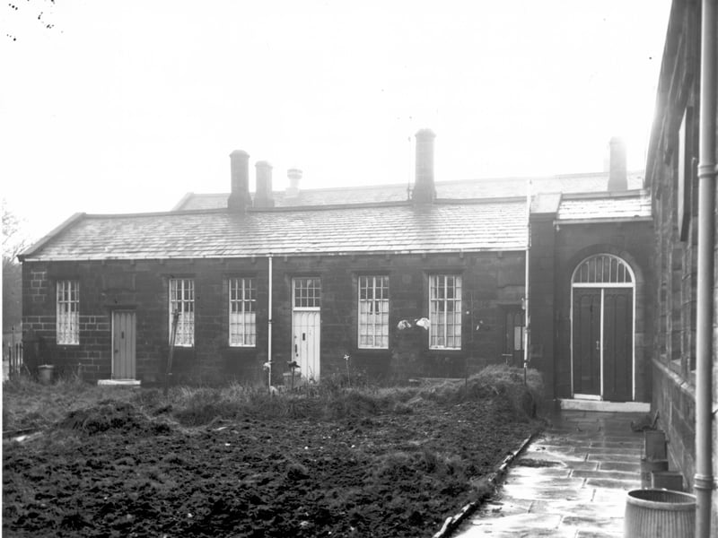 These three houses on Chapel Lane have been converted from Gott's Almshouses. Number 56 is on the left, 54 in the middle and 52 on the right, the doorway partially obscured by the entrance to the former Armley Higher Grade National School which closed in 1966.