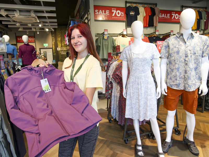 Darcy Brooks holding a woman's soft shell water resistant jacket at the new Mountain Warehouse in Gunwharf.