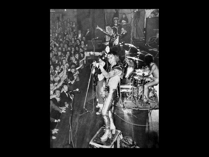 Slade playing at the Civic Hall, Wolverhampton, in June 1973. Nearest the camera is guitarist Dave Hill. The Wolverhampton Chronicle reported that there was a knockout atmosphere at two Slade concerts which set Wolverhampton rocking. "On both occasions the Civic Hall was packed with teenyboppers who sat down in orderly rows and patiently watched the Alex Harvey Band go through their routine. Then Slade appeared - and all hell was let loose..."