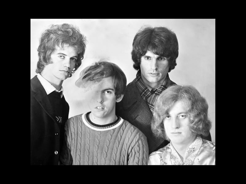 Here they are in the late 1960s as Ambrose Slade. From left, Jim Lea, Dave Hill, Don Powell, and Noddy Holder. There's a reason why poor Dave has been partly painted out, but we'll come to that. The Express & Star's "Tops In Pops" column by John Ogden in February 1969 was all about how at the age of 17 Jim Lea, of Codsall, was well on the way to becoming one of the youngest record producers in the country, although Jim's website says he was born in June 1949, which means he would in fact have been 19 at the time. The article was accompanied by this photo cropped to Jim's head and shoulders. To stop Dave Hill's bonce intruding onto the image, he was painted out. Sorry Dave.