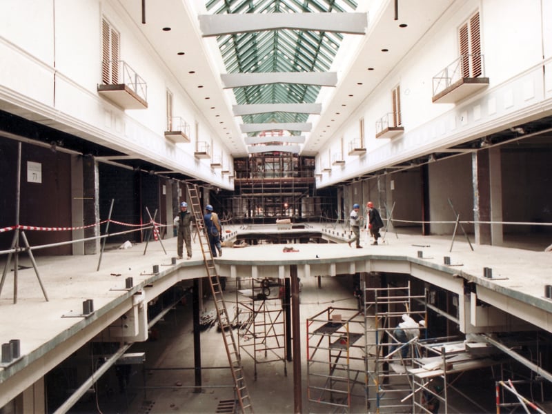 Workers diligently working at Meadowhall Shopping Centre, Sheffield, which was under construction during the first nine-months of 1990