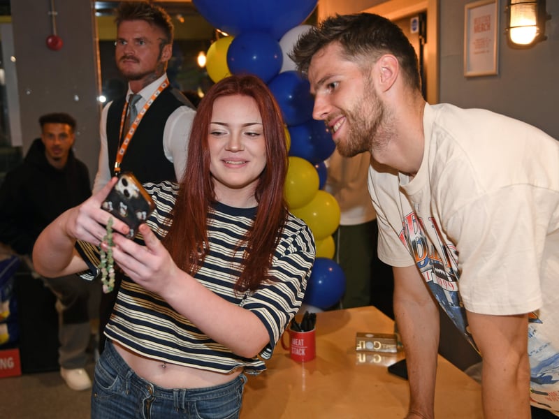 Anton Stach poses with a fan for a selfie