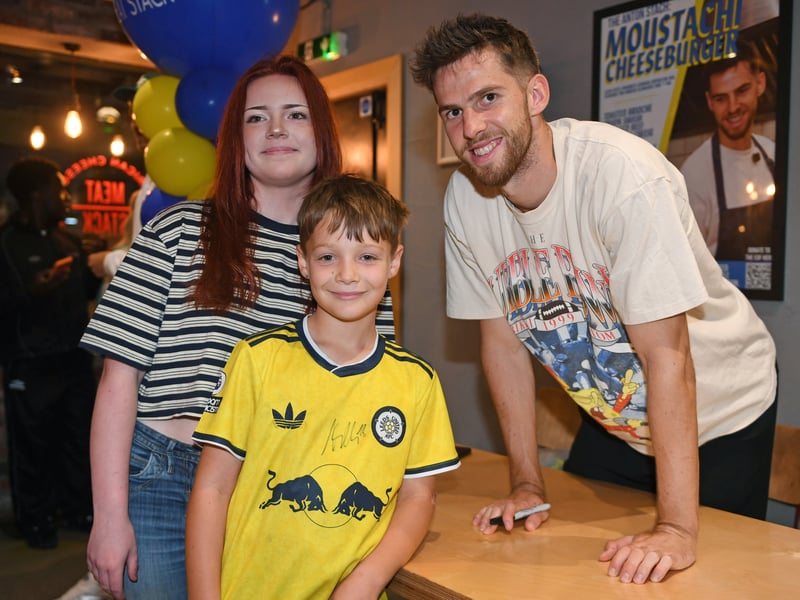 Anton Stach poses for photograph with fans