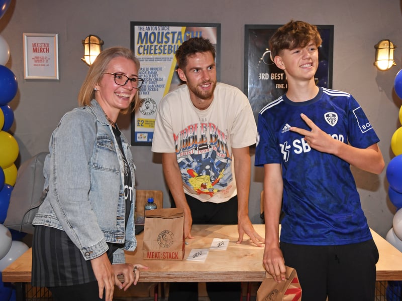 Anton Stach poses with fans for a photograph