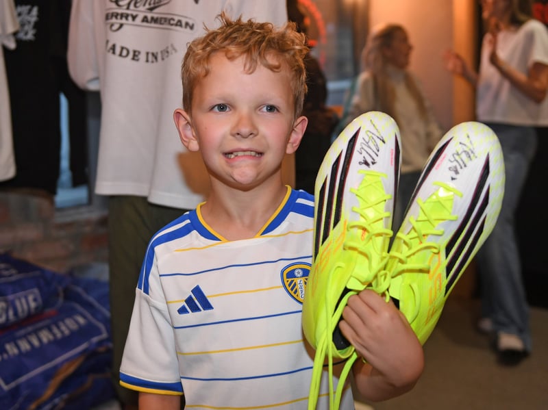 9 year old Austin Gallant with his new signed boots! 