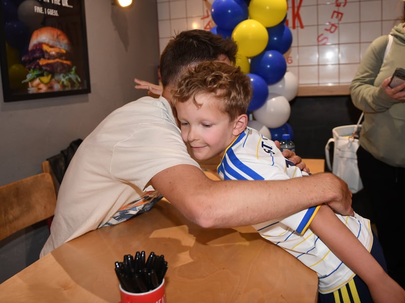 Austin Gallant , 9, who travelled all the way from Glasgow, hugs Anton Stach at the meet-and-greet