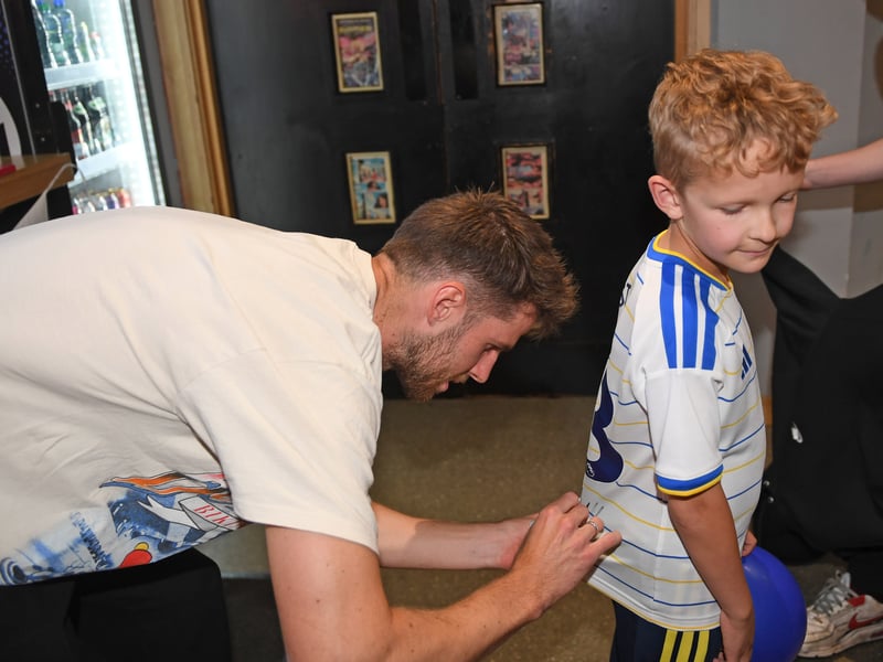 9 year old Austin Gallant, who travelled all the way from Glasgow with his mum to meet his favourite player, gets his shirt signed.
