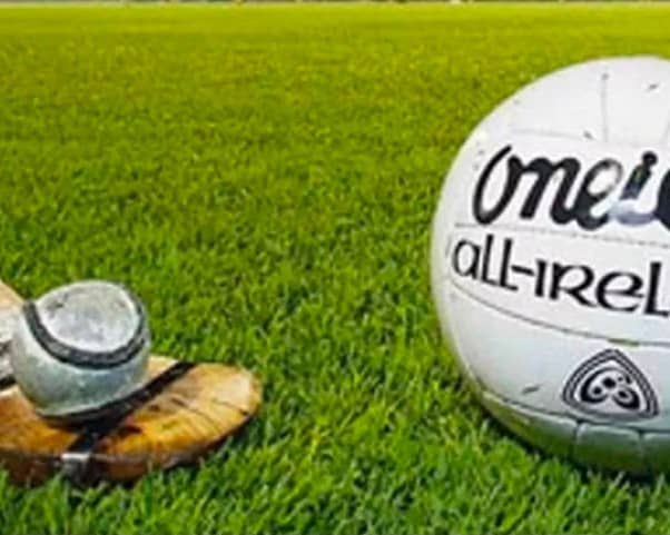 Sliotar and football on the pitch