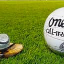 Sliotar and football on the pitch
