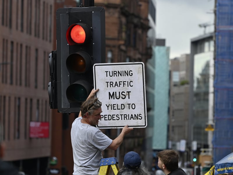 Street signs being installed.