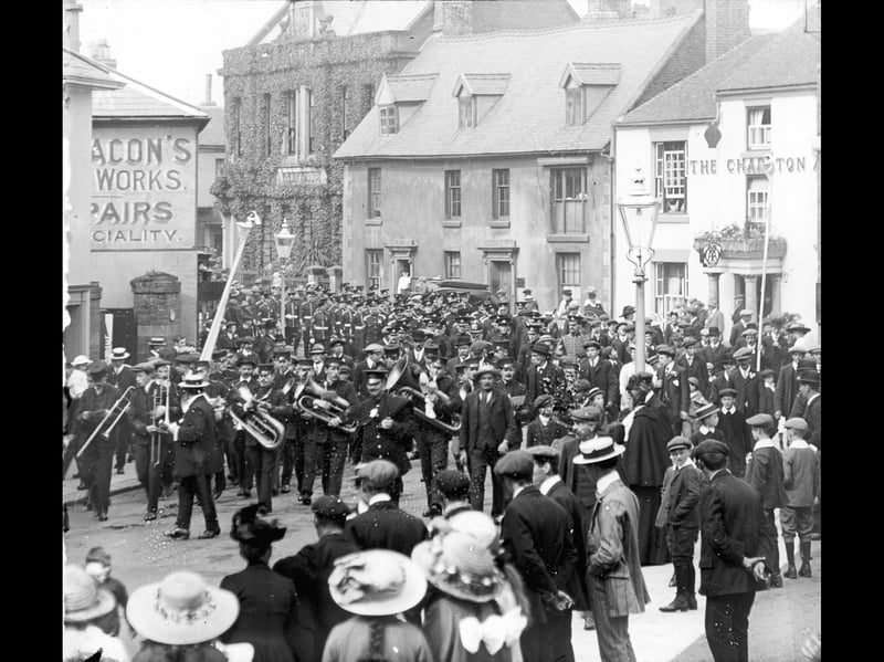 A band leads the military parade through Church Street in Wellington as locals line the street and watch. The Charlton Arms Hotel is on the right and the ivy-clad building was the police station. The late historian Allan Frost estimated this picture to be 1910 to 1912, but wasn't able to pinpoint what it was all about.