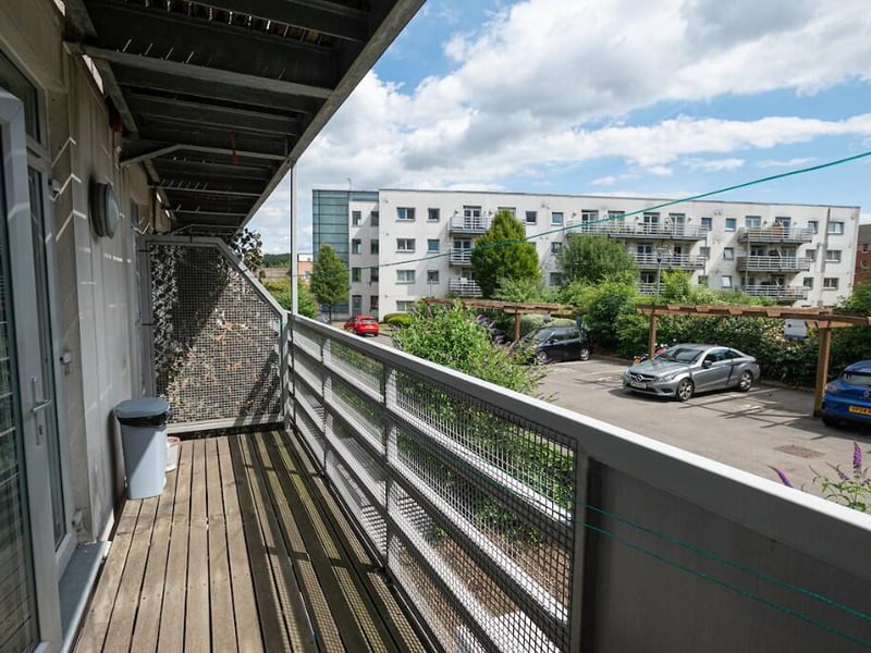 The apartment features a balcony, providing access to sunlight and fresh air