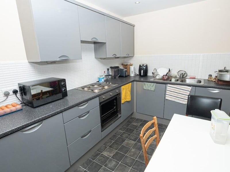 The kitchen is modern and open plan