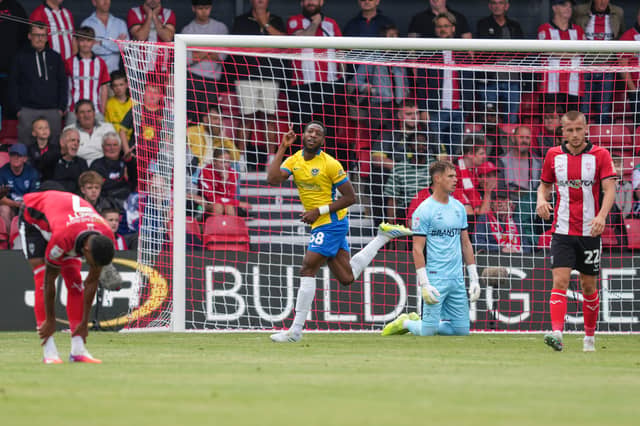 Ebou Adams celebrates his stunning strike which clinched a 3-1 victory for Pompey. Picture: Jason Brown
