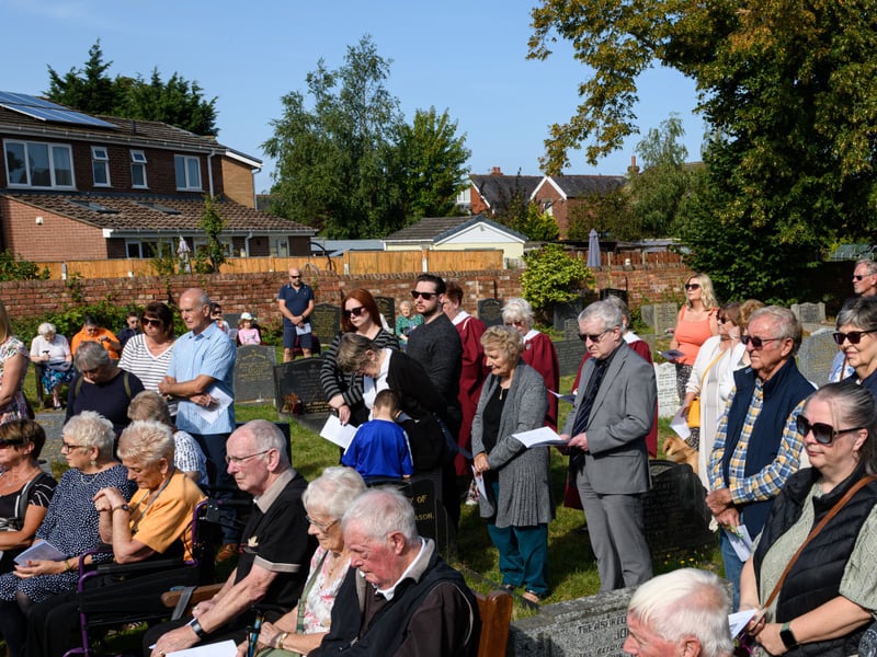 Members of the public listen on at the Freckleton Air Disaster Memorial at Holy Trinity Church. Photo: Kelvin Lister-Stuttard