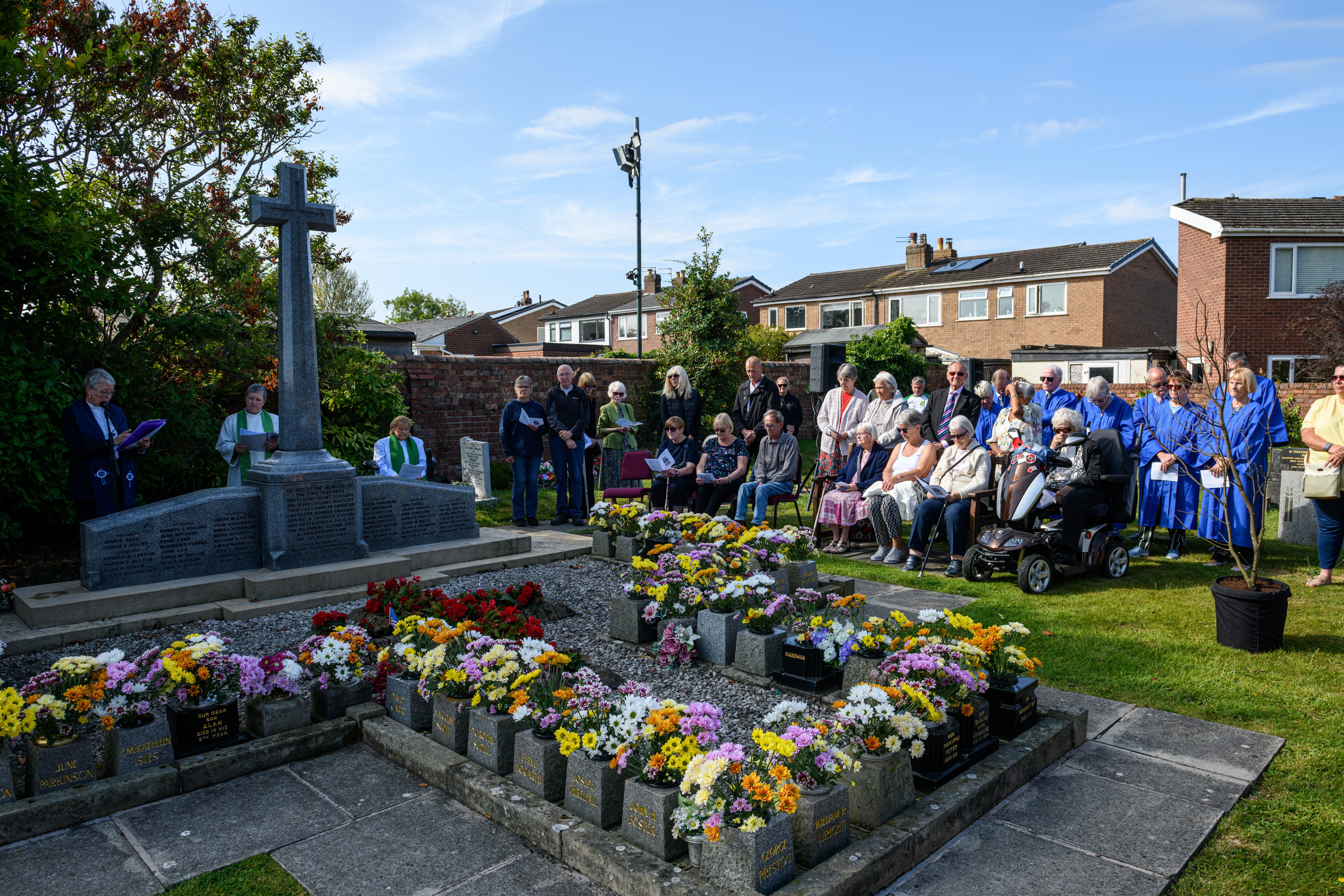 Members of the public listen on at the Freckleton Air Disaster Memorial at Holy Trinity Church. Photo: Kelvin Lister-Stuttard