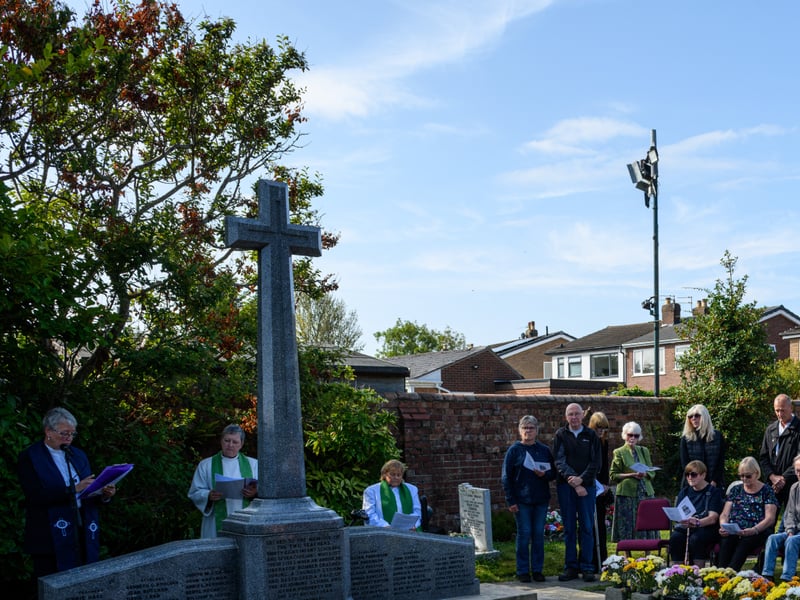 Members of the public listen on at the Freckleton Air Disaster Memorial at Holy Trinity Church. Photo: Kelvin Lister-Stuttard