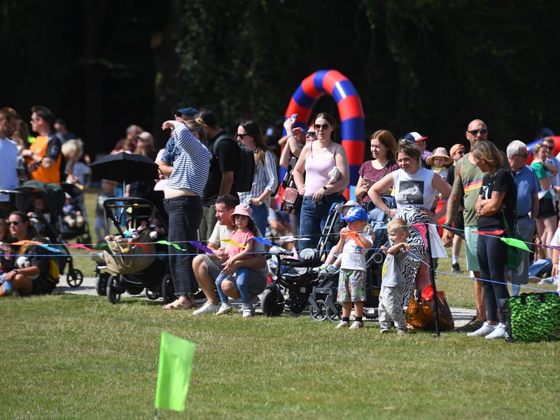 Crowds watch the displays.