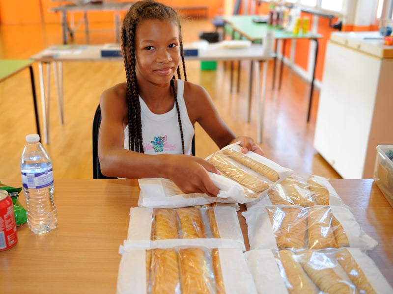 Allahnah May Rose Frederick , 9, helping with food and drink.