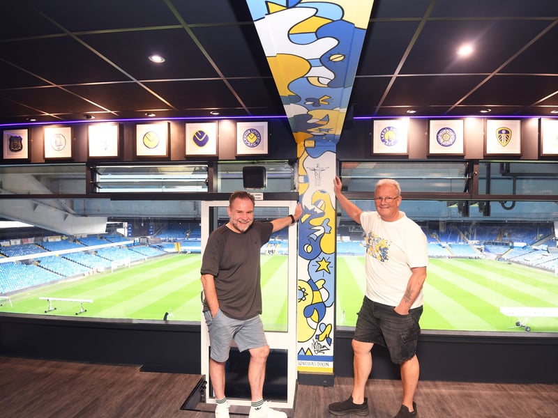 Pictured are artist Nicolas Dixon and Allan Irvine, project manager for Protech, who painted and built a bespoke design for Box 12 at Elland Road for the start of the 2026/27 season
