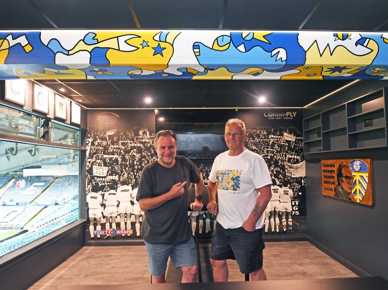 Pictured are artist Nicolas Dixon and Allan Irvine, project manager for Protech, who painted and built a bespoke design for Box 12 at Elland Road for the start of the 2026/27 season