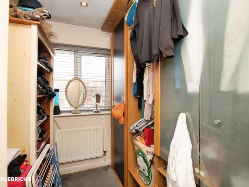 Bedroom three, currently used as a walk-in wardrbobe