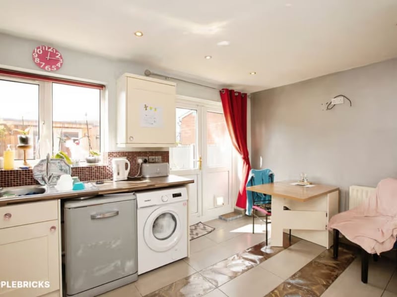 The kitchen has plenty of space for a dining table too