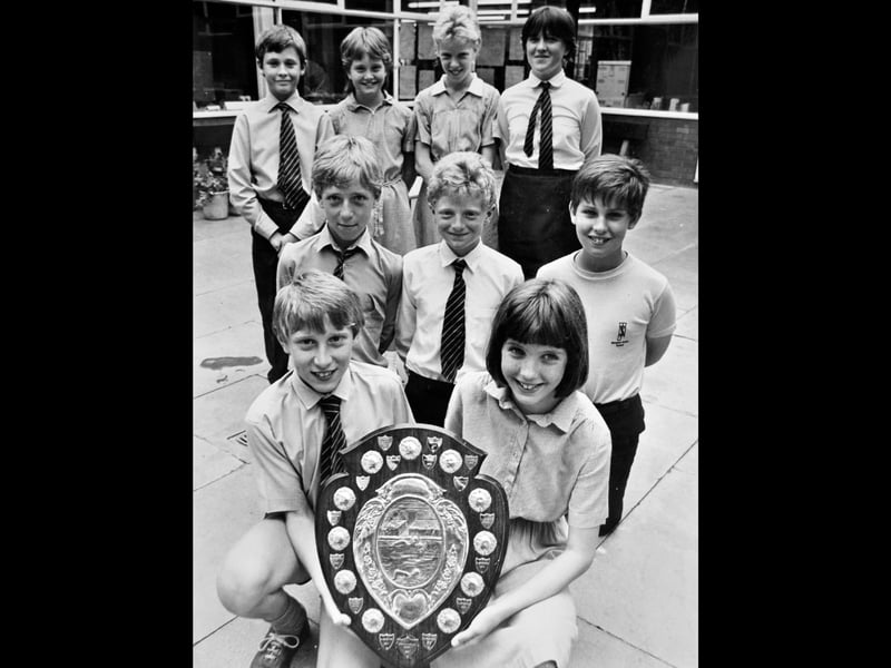Newport Junior School's swimming team proudly displays the shield they won after taking first place at the Telford Junior Schools' swimming gala at Wellington swimming pool in June 1988. Pictured are David Cole, Julie Hazeldine, Penny Lane, Kelli Tong, Richard Owen, Richard Williams, Michael Pocock, and captains Andrew Short and Elizabeth Banks. Do you recognise any of the swimmers, or remember school swimming galas like this one?