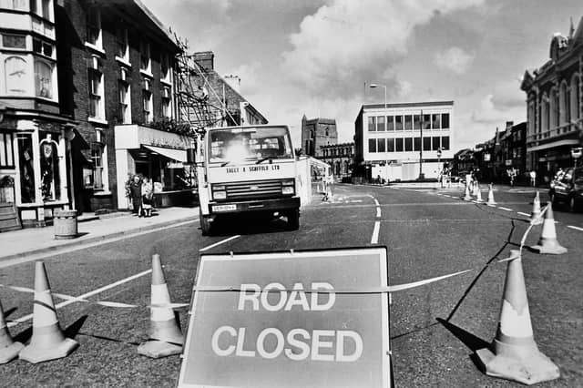 A road closed sign marks the disruption in Newport in September 1989, when urgent safety work led to diversions around the town. Experts feared a stone arch at the former Tuckers ironmongers could collapse, following another shop collapse less than a month earlier. Can you remember the road closures and disruption, or the old Tuckers shop before it disappeared?