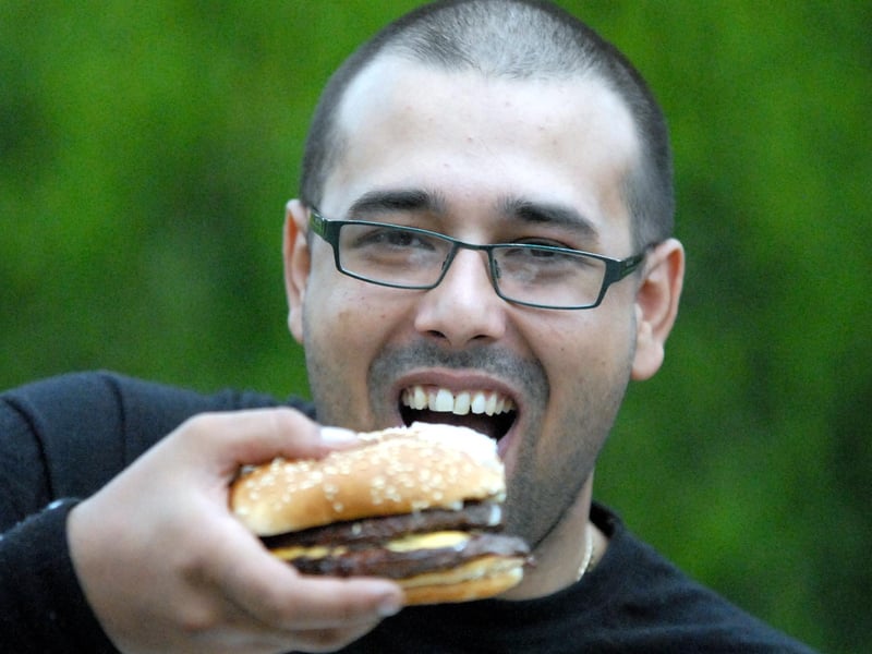 Feruz Hussain takes a bite out of this tasty burger in a mouth-watering scene from 2007.