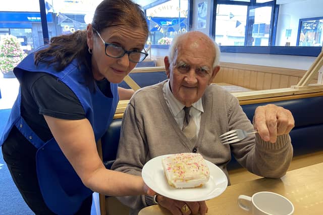 Billy Matthews enjoyed a slice of cake at Valentes Cafe in 2020, especially as it was served by his daughter Susan Dugan.