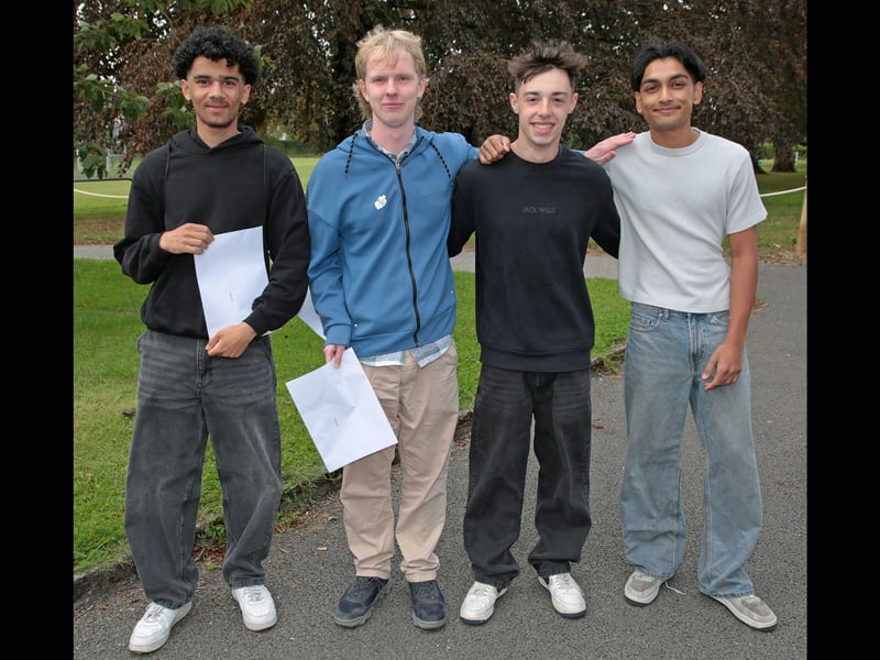 Students Travis Oselle, Liam Maguire, Nathan Moina, and Keyaan Sonloskhan