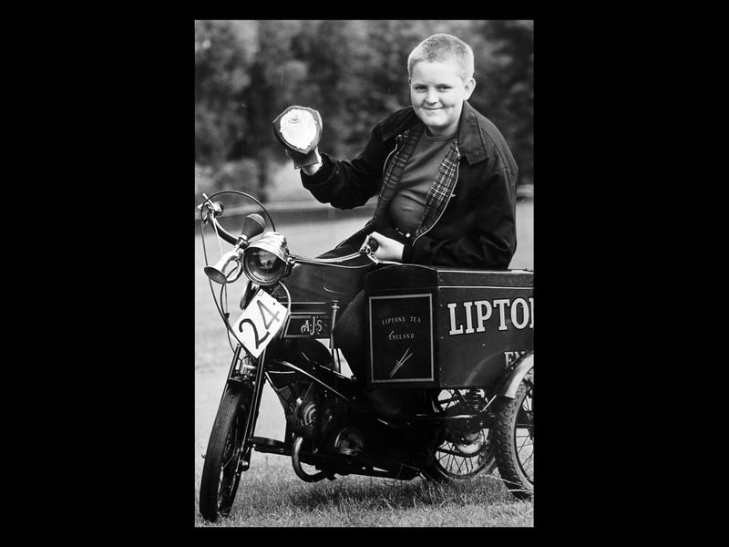 Mark Whittaker, aged 13, shows off his mini replica AJS model K6, which won him top prize in one of the classes at a vintage motorcycle rally in Walsall in June 1980. Mark, of Ryders Hayes Lane, Pelsall, took the prize in the 1915-1930 class for his 1925 machine. The town's fourth annual rally, held in the Arboretum, attracted enthusiasts from all over the Midlands.