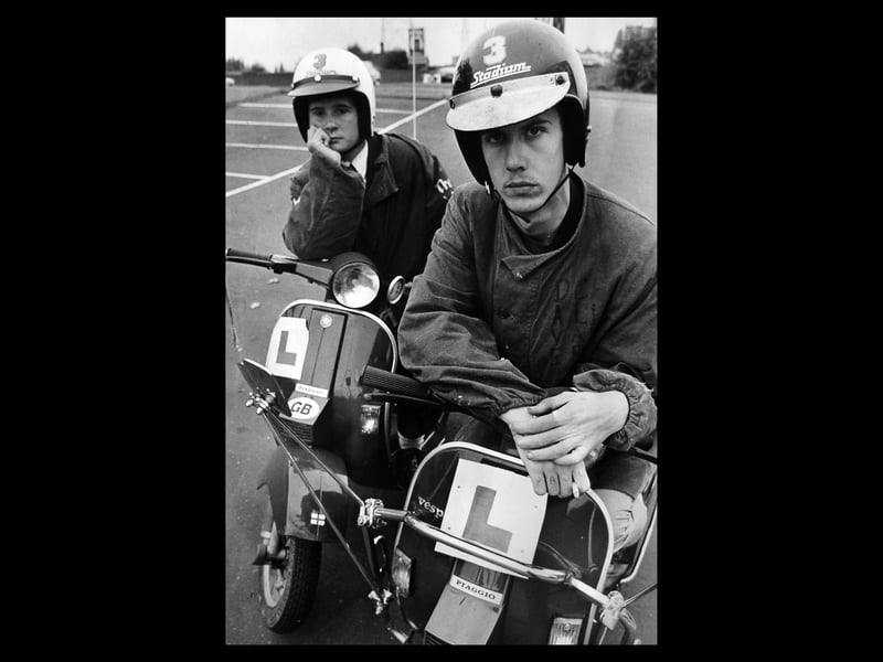 Scooter youths Mark Wells (left) and Paul Handley
were looking fed up in October 1983, and the accompanying story explained why: "A group of Wednesbury mods say 'don't blame us' after complaints about motorcycle gangs who are said to be terrorising people on estates in the town. Councillors say they have had a flood of protests about high speed riders roaring around. But 10 mods who gather in St Luke's Road, Mesty Croft, claim they are being held responsible unfairly. One, trainee coremaker Paul Handley, aged 16, of Kent Road, Woods estate, said: 'It is ridiculous to say our bikes are high speed. My scooter's top speed is only 25mph.' Mark Wells, also 16, of St Luke's Road, said their group caused no noise."