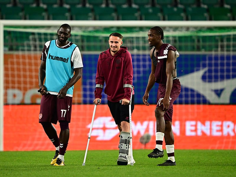 Tom Renaud of Heart of Midlothian with teammates after the UEFA Conference League 2026/27 Play Off Round Second Leg match between SK Rapid and Heart of Midlothian