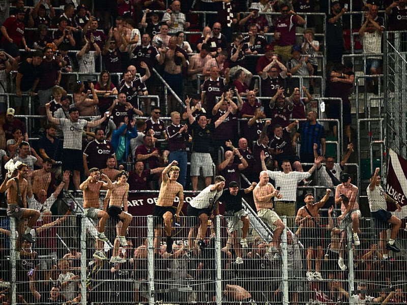  Heart of Midlothian fans celebrate after the UEFA Conference League 2026/27 Play Off Round Second Leg match between SK Rapid and Heart of Midlothian 
